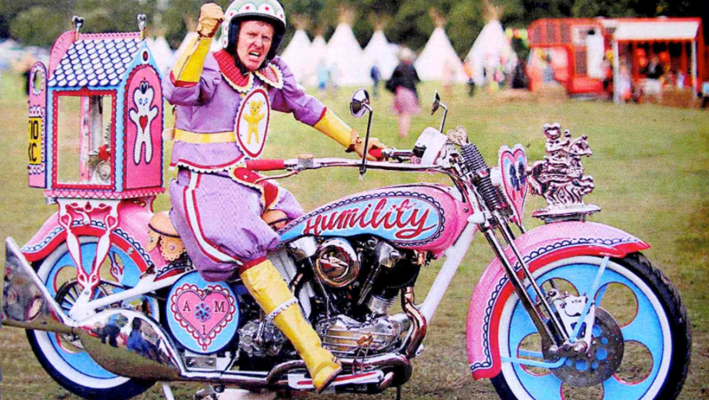 UK artist Sir Grayson Perry with his custom Harley—a meditation on masculinity and vulnerability embodied in one person.