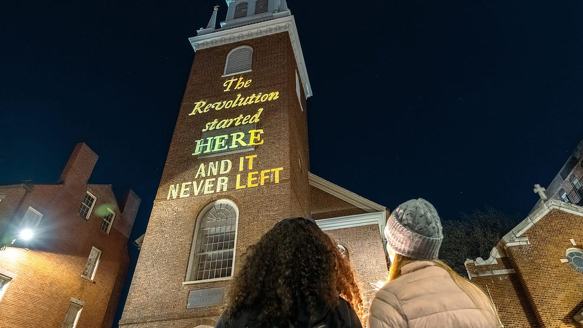 "The Revolution Started Here and It Never Left" guerilla light installation by the Boston art collective, Silence Dogood. Image: Mike Ritter, via Yello by Hunter Schwarz.