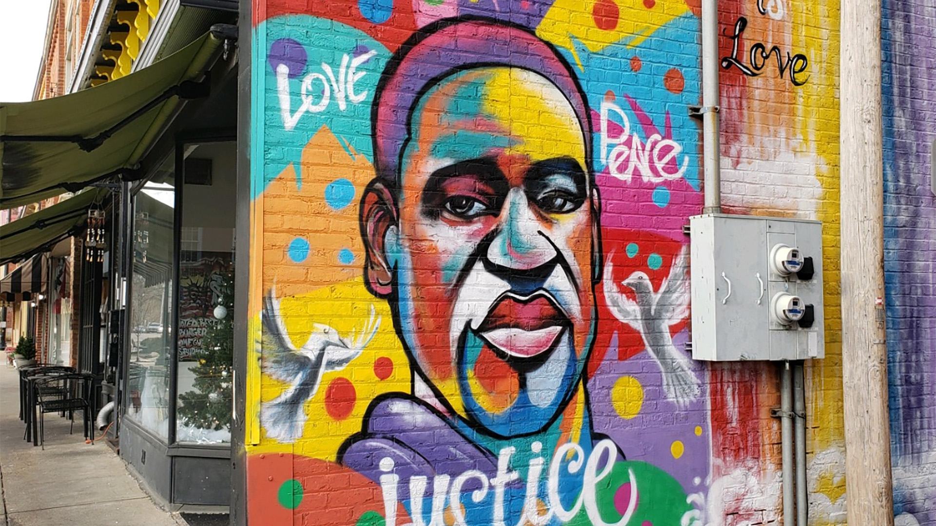 A mural honoring George Floyd rises in Marietta, Ohio, painted in August 2021.