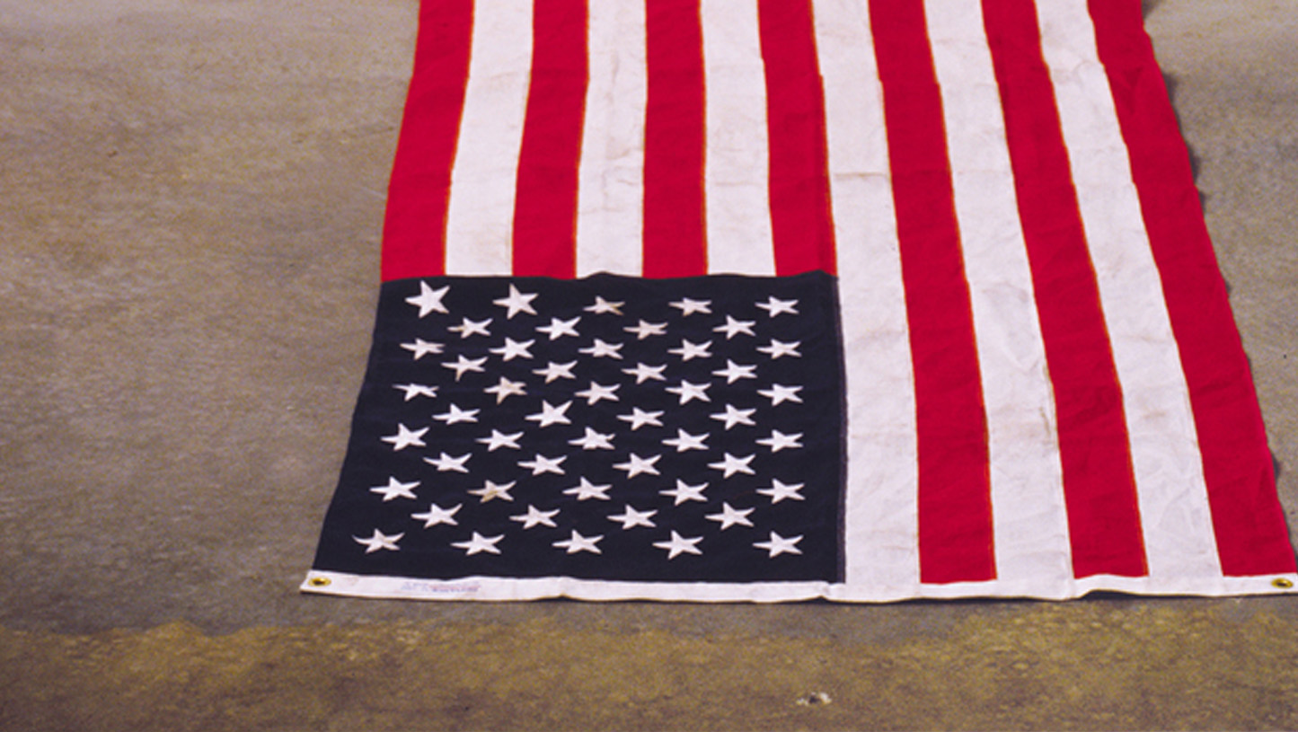 Detail from Dread Scott’s 1989 installation "What is the Proper Way to Display a US Flag?"