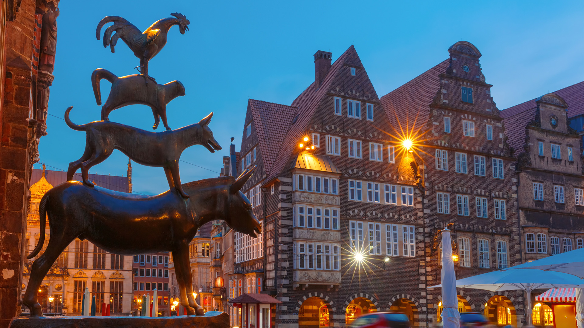 Bronze statue of the Bremen Town Musicians—donkey, dog, cat, and rooster—stacked together in Bremen, Germany, symbolizing unity and shared strength.